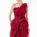 HAPPY CLOTHING CULT MIA X burgundy sculpted petal one-shoulder gown with elegant draping and fitted silhouette.