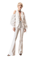 Vaska white denim cut-out jacket with long sleeves and stylish design, displayed on a hanger against a plain background.