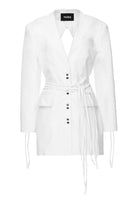 Vaska denim white jean jacket dress hanging on a hanger, showing long sleeves and classic jacket style, size XS.