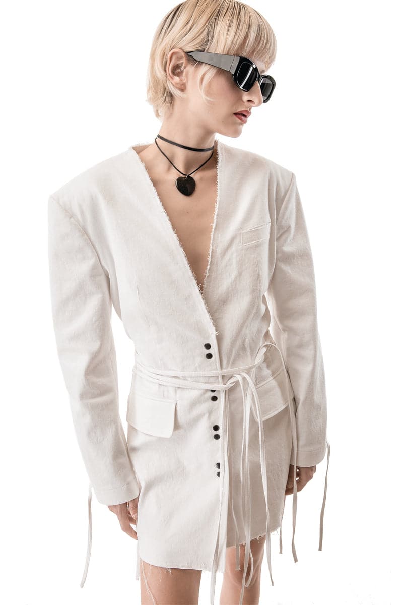 Vaska white denim jean jacket dress displayed on a hanger, featuring a classic jacket style with long sleeves and button front.