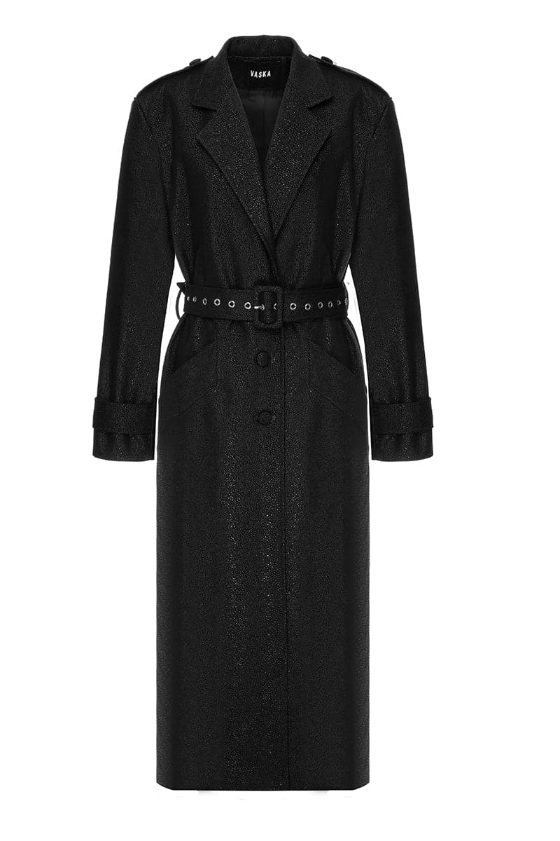 Black textured vegan leather trench coat by Vaska, stylish and lightweight, shown on a model with features visible.
