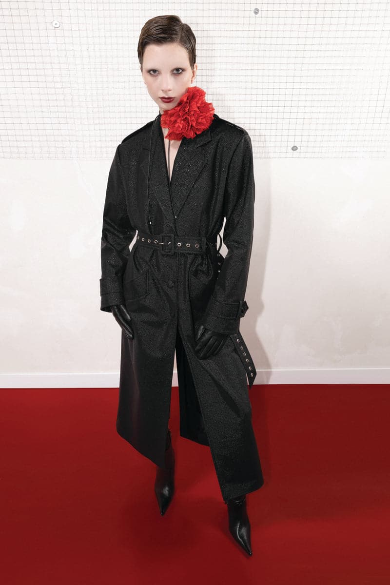 Black textured vegan leather trench coat by Vaska, stylish and modern coat with a sleek finish, shown in size XS.