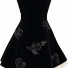 Black URBAN MUSE Velours mini dress displayed on a hanger, showcasing its soft velvet fabric and stylish mini length.