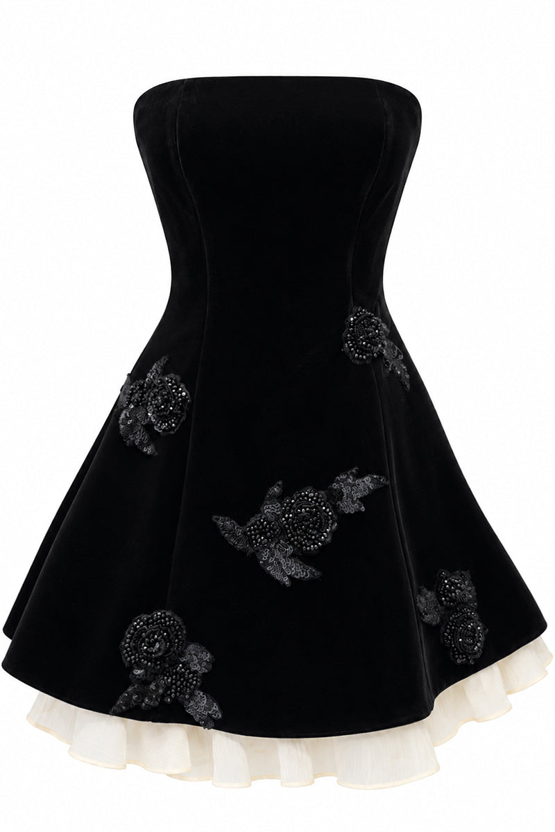 Black URBAN MUSE Velours mini dress displayed on a hanger, showcasing its soft velvet fabric and stylish mini length.