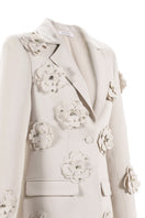 Close-up of Aquarel Studio Flora Blazer in white, showcasing the tailored blazer's fabric and detailed stitching.
