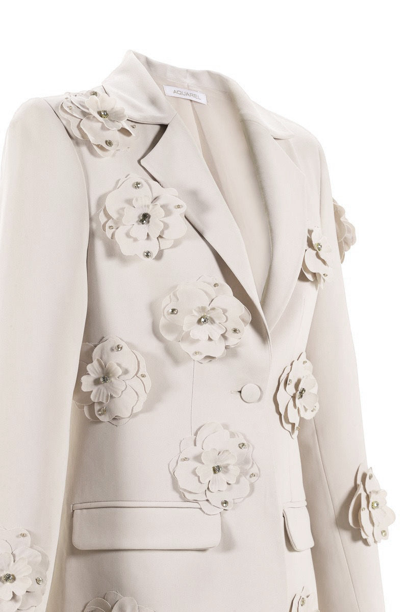 Close-up of Aquarel Studio Flora Blazer in white, showcasing the tailored blazer's fabric and detailed stitching.
