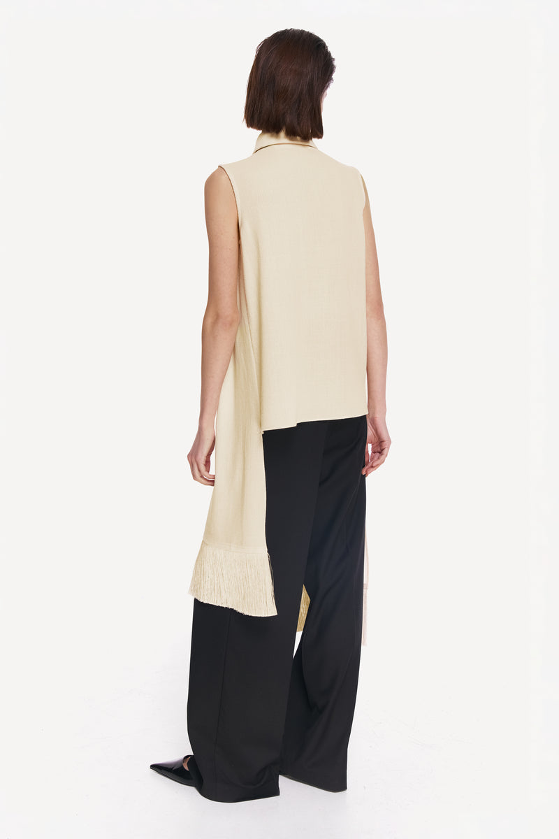 Warm ivory shirt scarf with silk fringe, styled as a casual shirt with a soft, flowing fabric and elegant fringe detailing.