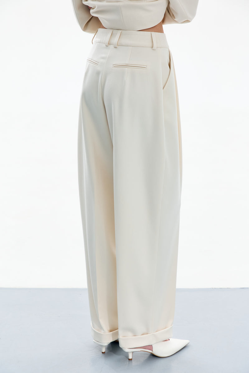 Back view of DELEGAN Line White Pants, stylish pants with a relaxed fit, showcasing the waistband and clean design.