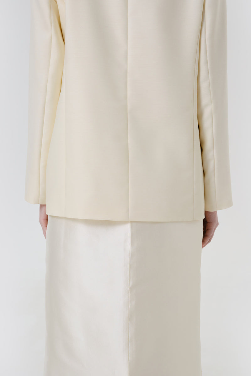 Back view of a DELEGAN STILL FORM blazer jacket, showcasing the tailored fit and stylish design.
