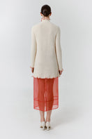 Red blush midi dress by DELEGAN, shown from the back with a flowing silhouette and elegant design.