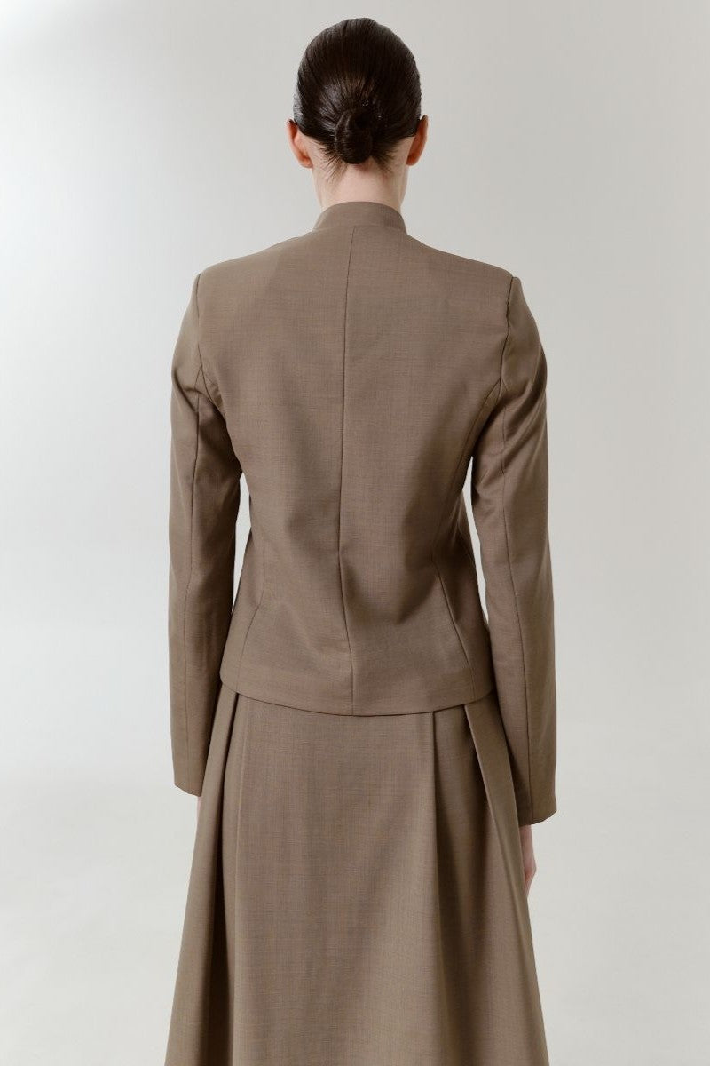 DELEGAN wool midi skirt shown from the back, featuring a high waist and classic A-line silhouette, made of soft, warm fabric.