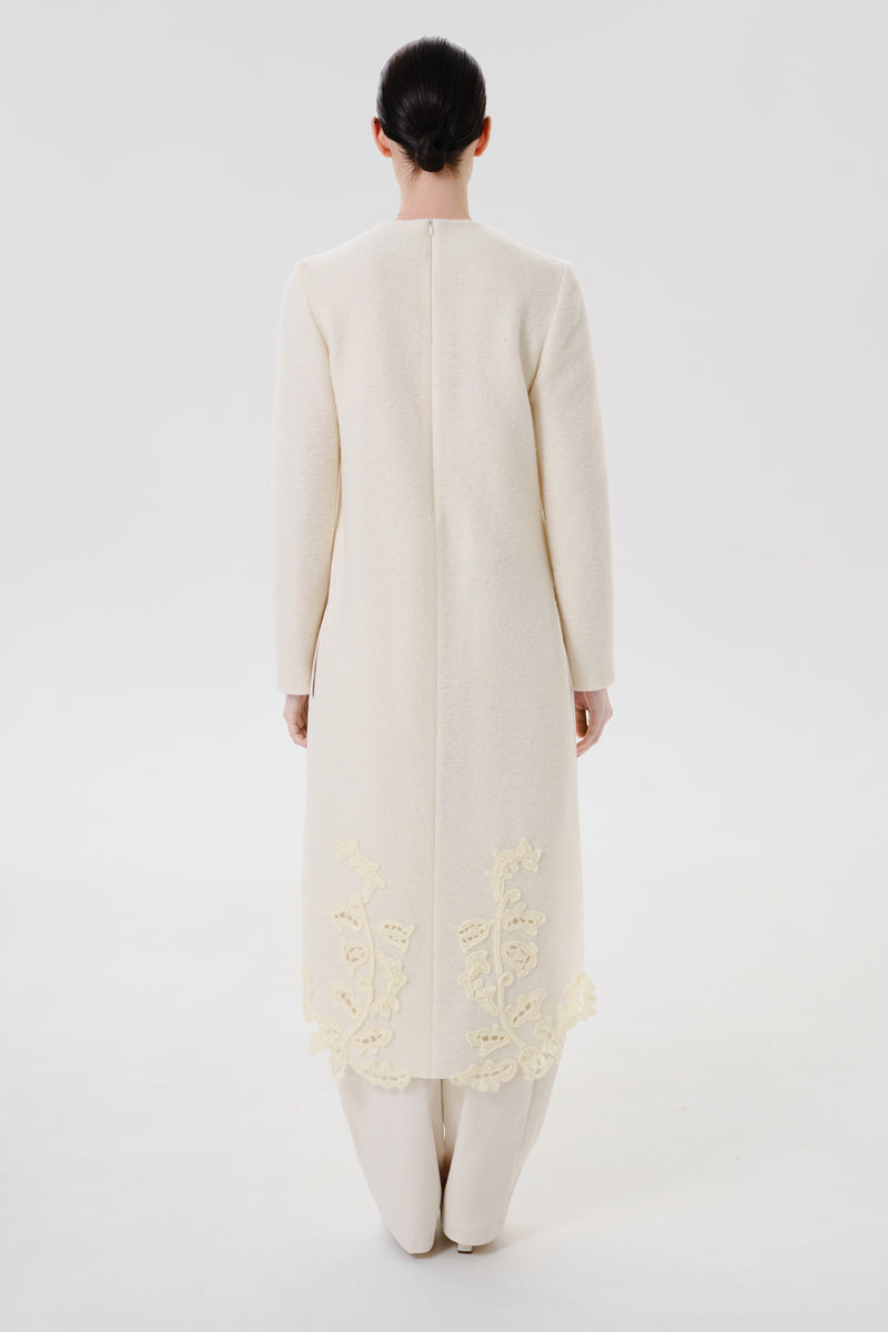 Back view of DELEGAN statement wool midi dress, showcasing its stylish design and tailored fit.