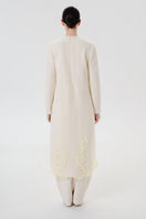 Back view of DELEGAN statement wool midi dress, showcasing its stylish design and tailored fit.
