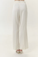 Ivory satin pants with belt from DELEGAN, shown from the back, featuring smooth fabric and stylish waist detail.
