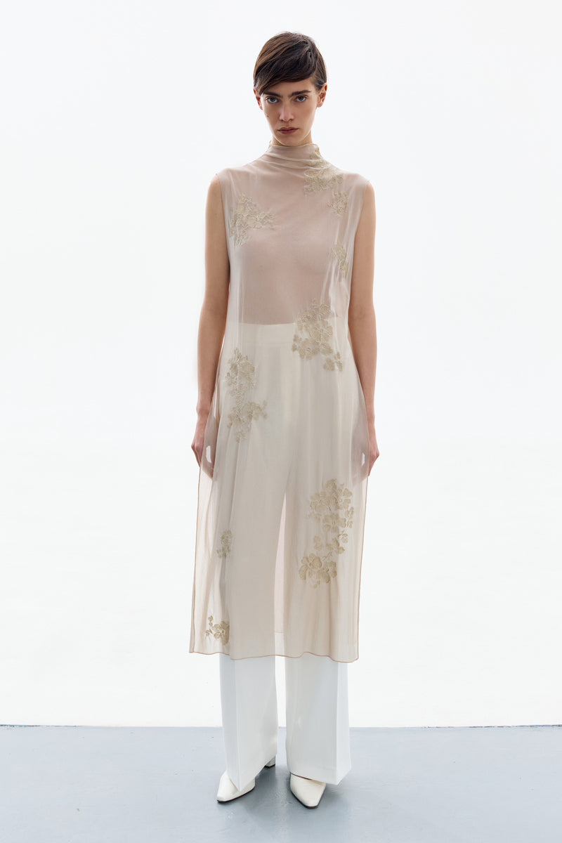 DelegaN brass bloom midi dress worn front view, featuring floral pattern and elegant design for stylish occasions.