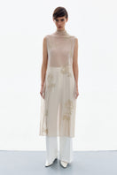 DelegaN brass bloom midi dress worn front view, featuring floral pattern and elegant design for stylish occasions.