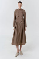 Delegan wool midi skirt displayed on a model, featuring a classic A-line design in cozy, textured wool fabric.
