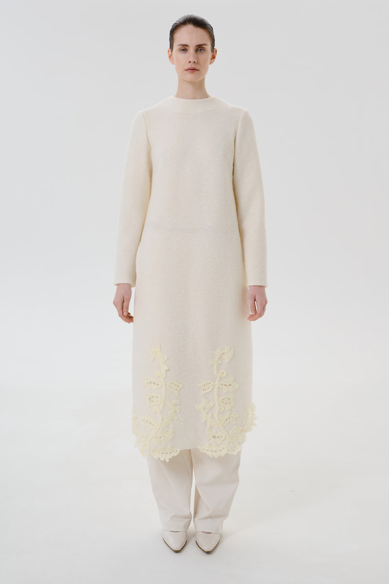 Front view of DELEGAN statement wool midi dress featuring a stylish design and cozy fabric, perfect for elegant everyday wear.