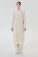 Front view of DELEGAN statement wool midi dress featuring a stylish design and cozy fabric, perfect for elegant everyday wear.