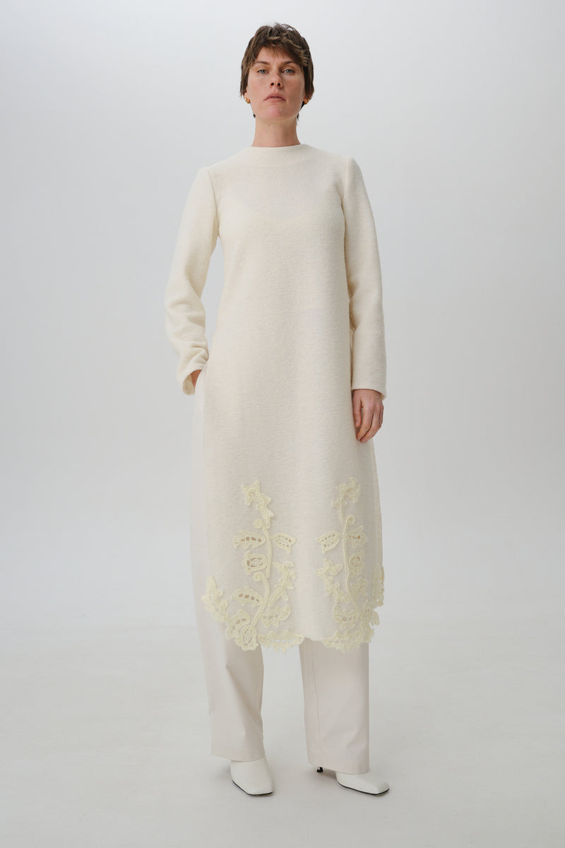 Front view of DELEGAN statement wool midi dress featuring a stylish, tailored design with a fitted waist and elegant length.