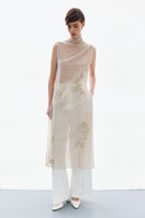 Front view of a brass floral midi dress from DELEGAN featuring a fitted bodice and flowing skirt.