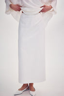 White midi skirt with knitted ornament detail by DELEGAN, featuring a flattering fit and stylish design.