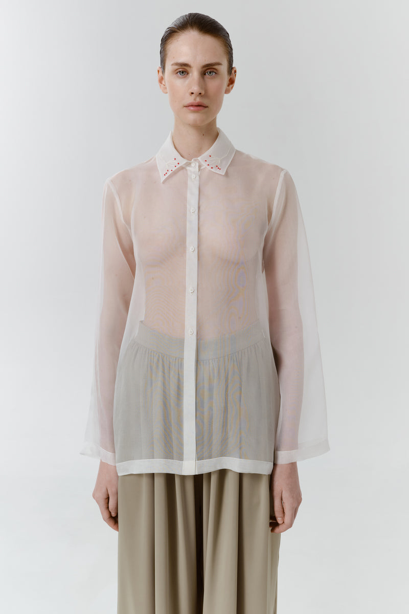 Red Trace silk shirt by DELEGAN, shown worn front view with a classic fit and smooth silk fabric.