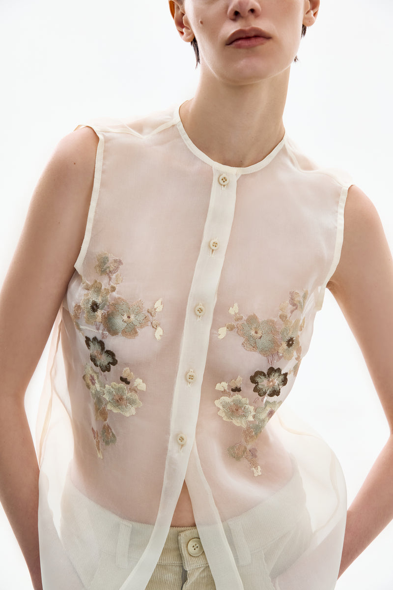 Front view of DELEGAN Silk Blossom Embroidered Shirt featuring intricate floral embroidery on smooth silk fabric.