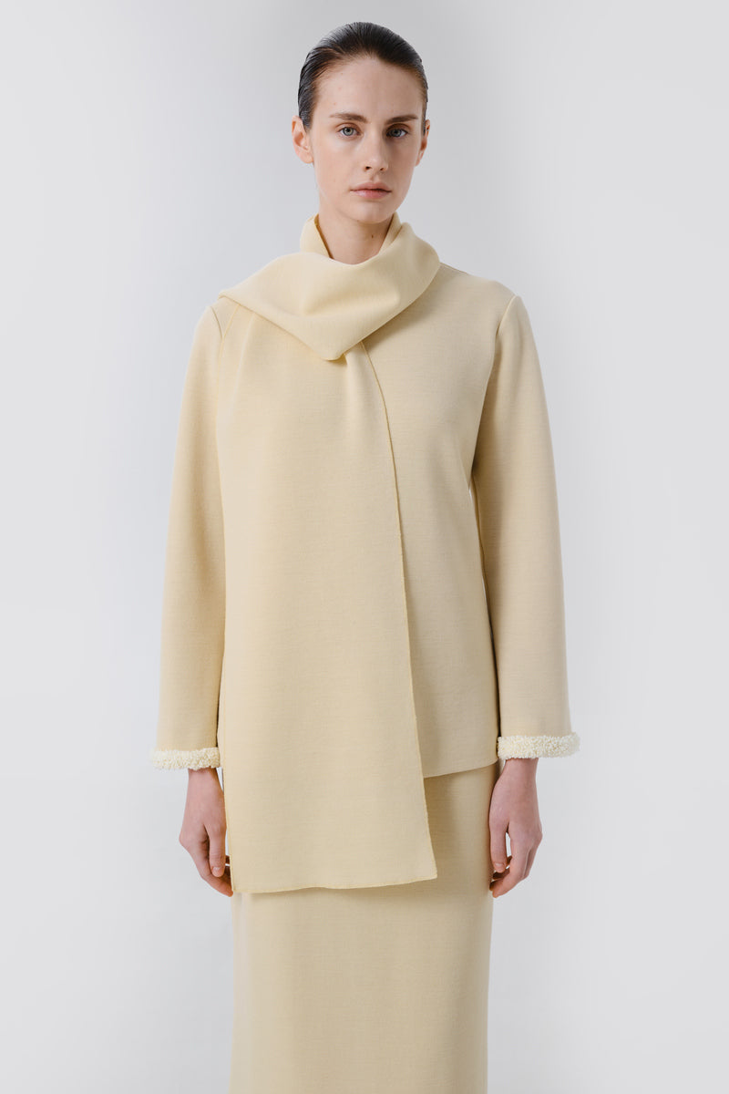 Delegan wool sweater showing a cozy, fitted front view in soft knit fabric with subtle color details.