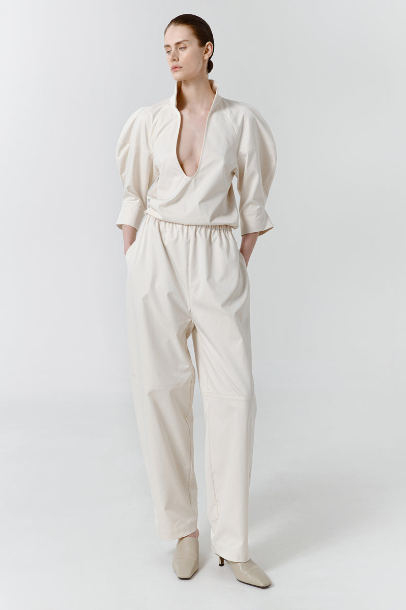 Gray-beige structure pants by Delegan, front view showing tailored fit and sleek design.