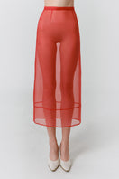 Red veil midi skirt by DELEGAN, shown worn front view, featuring flowing fabric and stylish design.