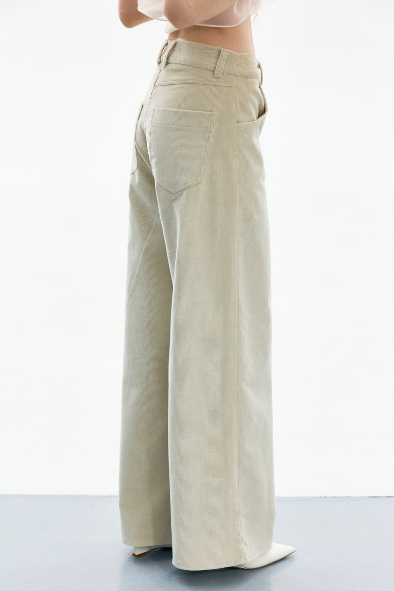 Delegen velvet green and gray pants displayed from the side, featuring a relaxed fit with soft fabric and stylish design.