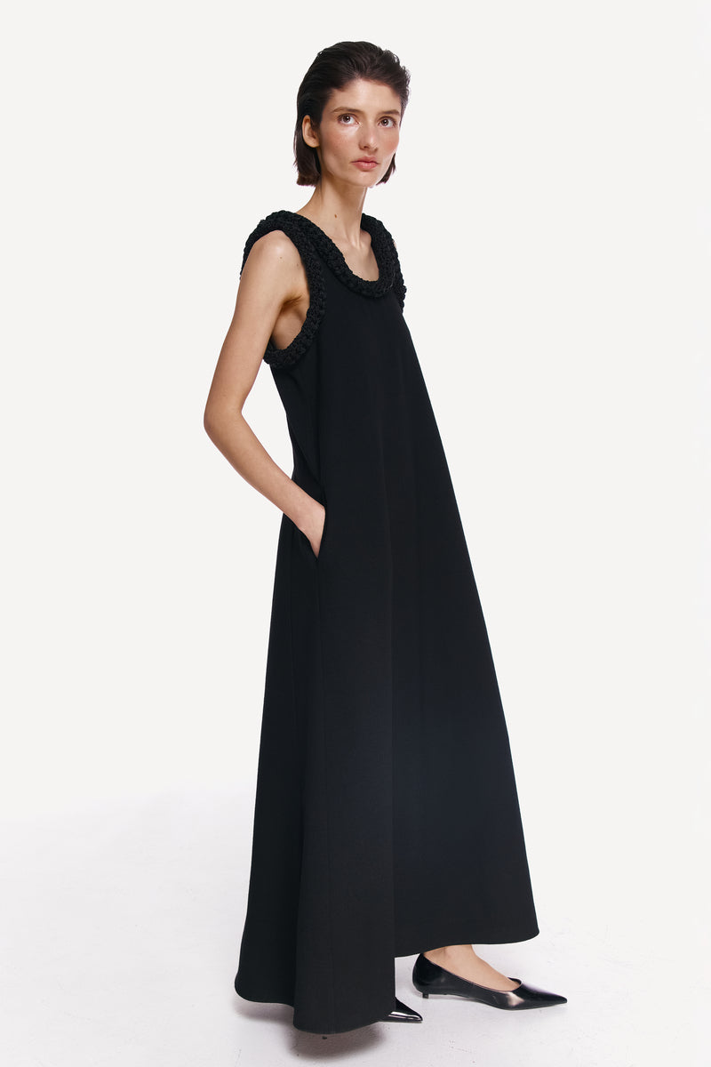 DELEGAN KOSSA maxi dress shown from the side, flowing fabric, elegant design, perfect for summer or casual occasions.