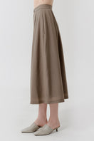 DELEGAN wool midi skirt worn side view, showing soft fabric and classic midi length, perfect for stylish fall outfits.