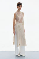 DELEGAN Brass Bloom midi dress shown from the side, featuring a stylish, flowy design with a fitted waist and elegant fabric.
