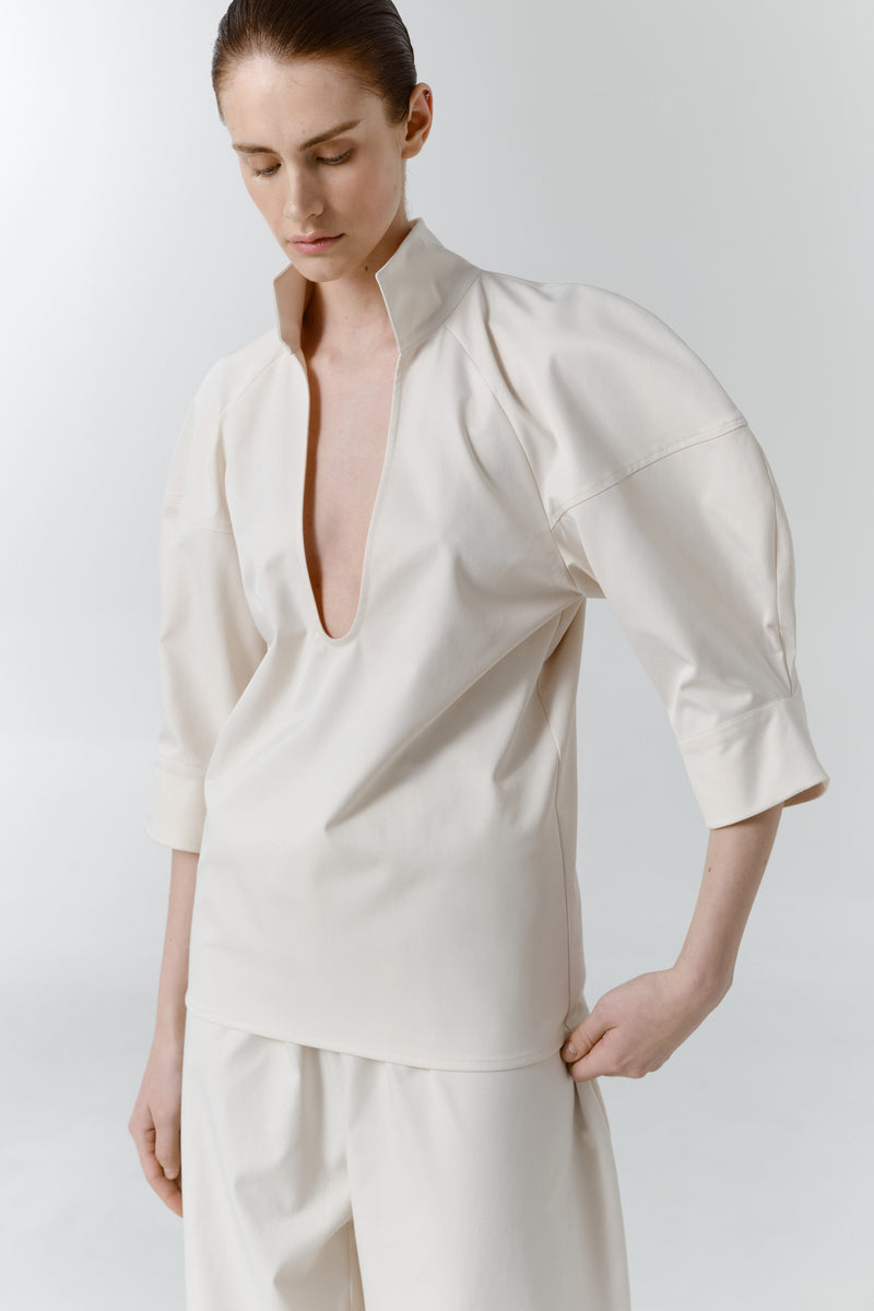 Gray-beige structure shirt by DELEGAN, shown from the worn side, featuring a tailored fit and subtle textured fabric.