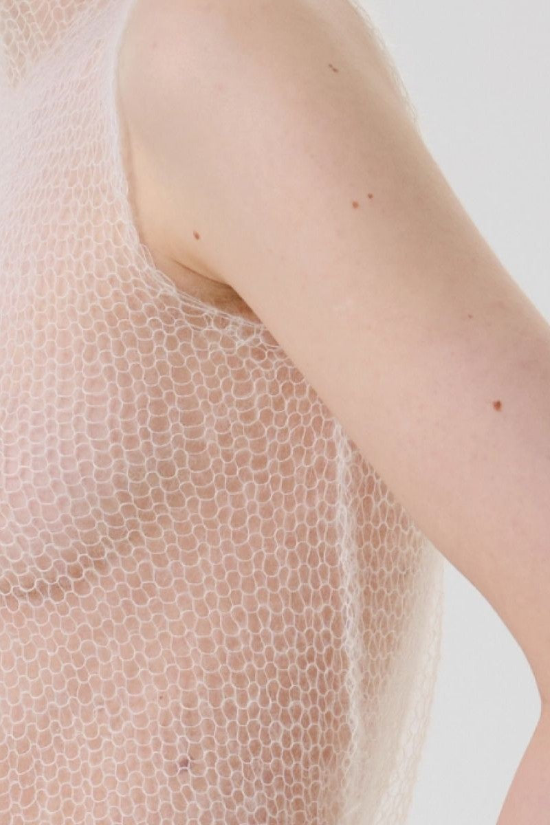 DELEGAN soft skin long sheer knit top worn by a person, lightweight and breathable, perfect for layering or casual wear.