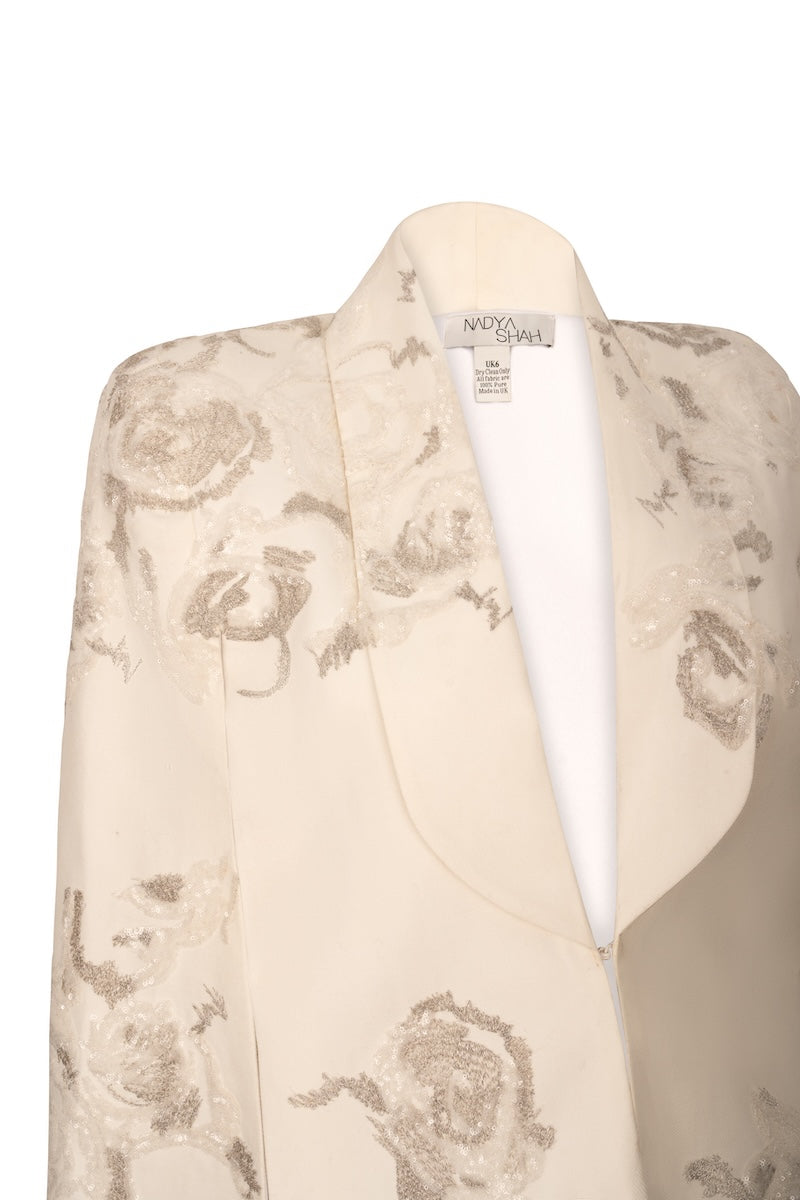 Nadya Shah Lumiere Cape jacket in elegant fabric, showcasing its flowing design and stylish silhouette.