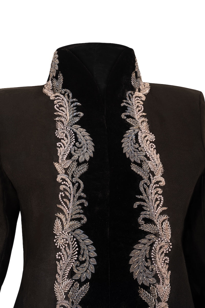 Nadya Shah Mercurial Jacket displayed on a hanger, featuring a sleek design with a high collar and zipper closure.