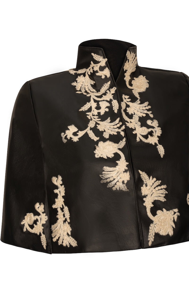 Nadya Shah Cape Victoire jacket in stylish design, featuring a tailored fit and elegant details, displayed on a hanger.