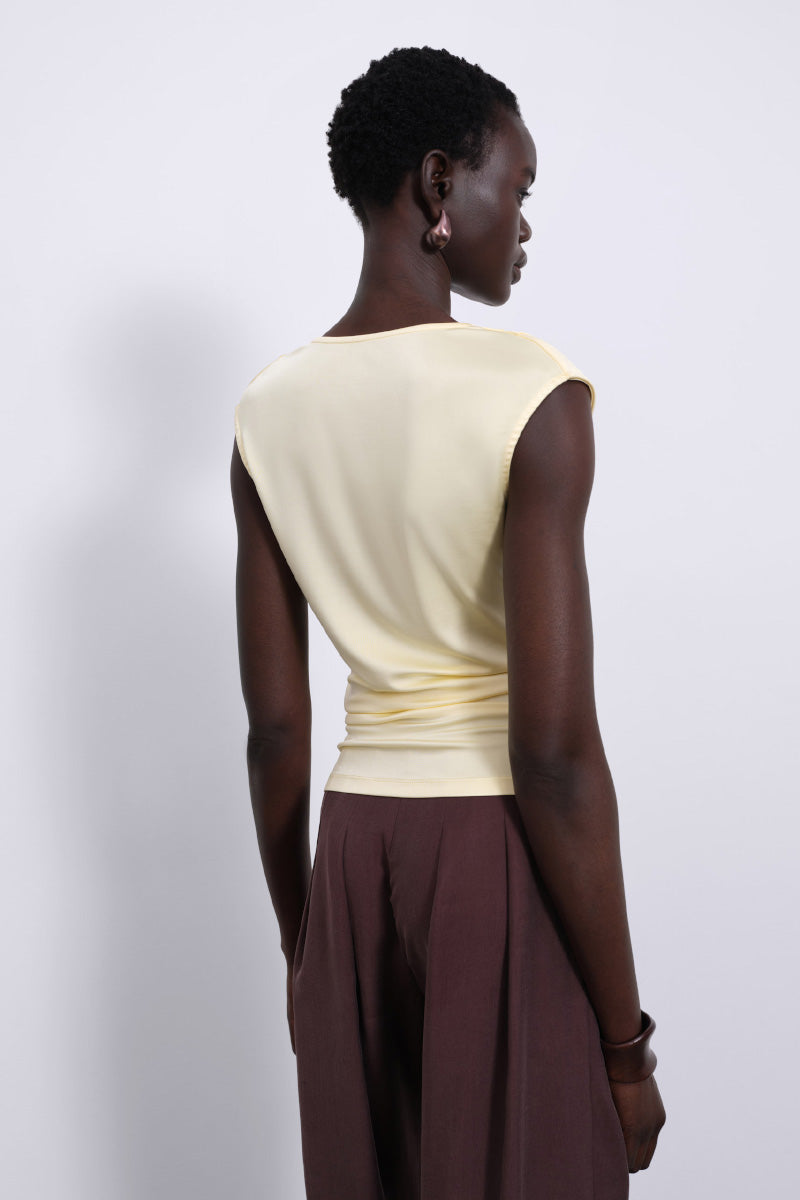 Yellow YLUNE Liquid Drape Top by SÉLONE, showcasing its soft fabric and elegant drape design in butter yellow.