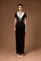 Elegant black gown with sweetheart neckline and bowtie detail by HACCHIC COUTURE, perfect for formal occasions.