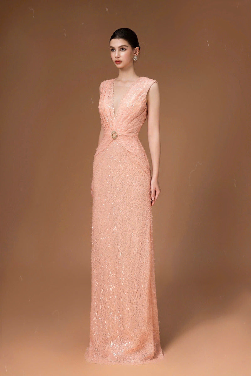 Pink sequin long gown by HACCHIC COUTURE, featuring a flowing silhouette and intricate sequin detailing.