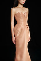 Hacchic Couture Sendra strapless bow gown in nude caramel, elegant evening dress with a fitted bodice and flowing skirt.