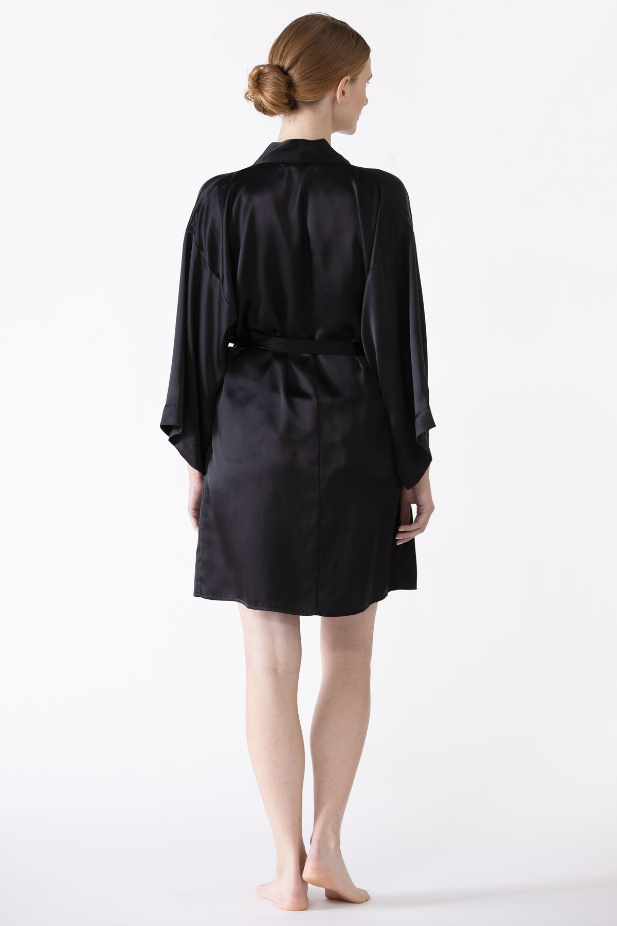 NK IMODE zero waste black robe displayed from the back, showcasing the sustainable design and relaxed fit of this stylish robe.
