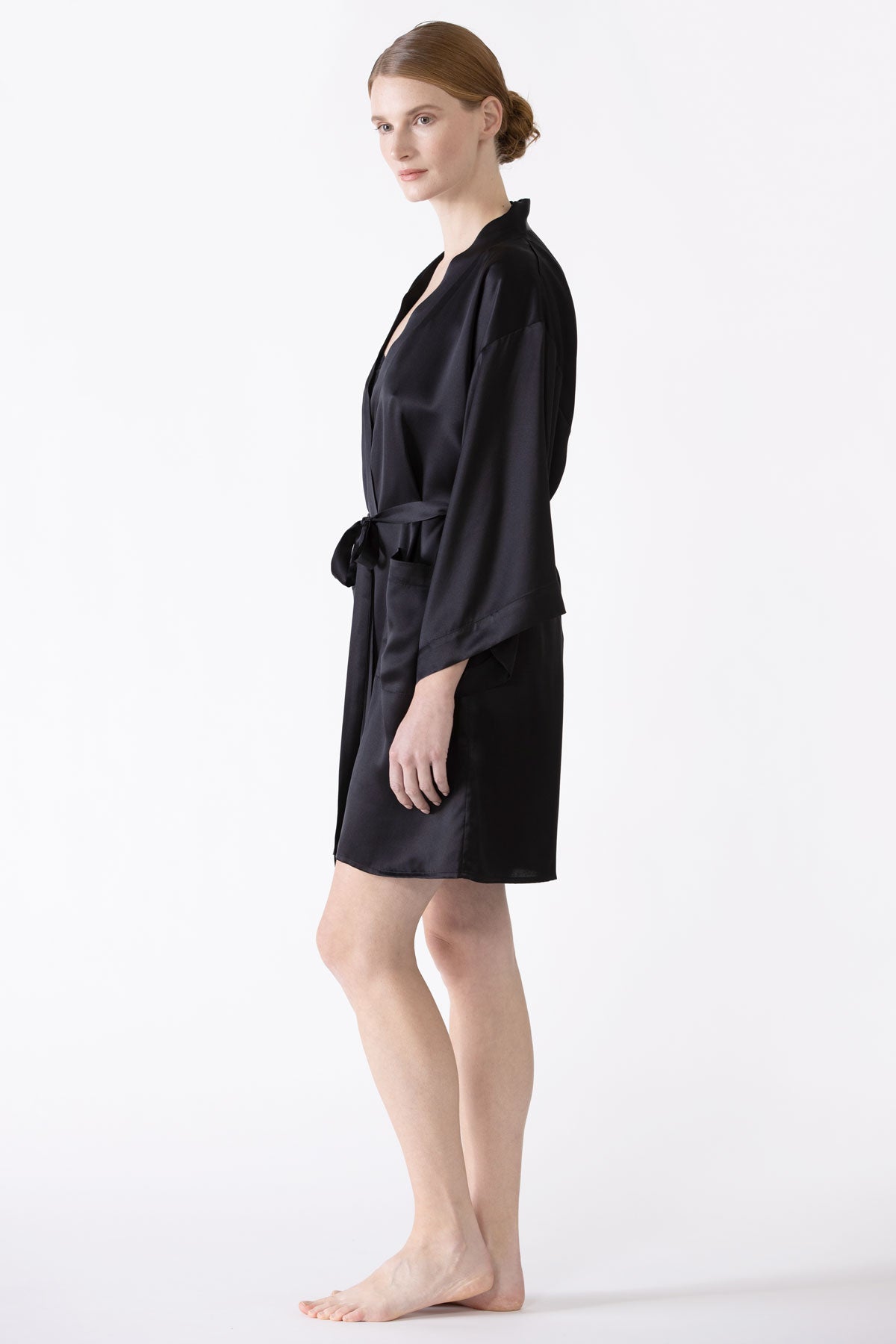 Black NK IMODE zero waste robe displayed from the side, showcasing its sleek, eco-friendly design and comfortable fit.