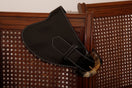 Black leather belt by Adriana Castro with a sleek, minimalist design, perfect for adding sophisticated style to any outfit.