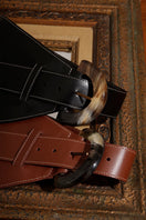 Black leather belt from Adriana Castro's La Jefa collection, featuring a sleek design and high-quality craftsmanship.