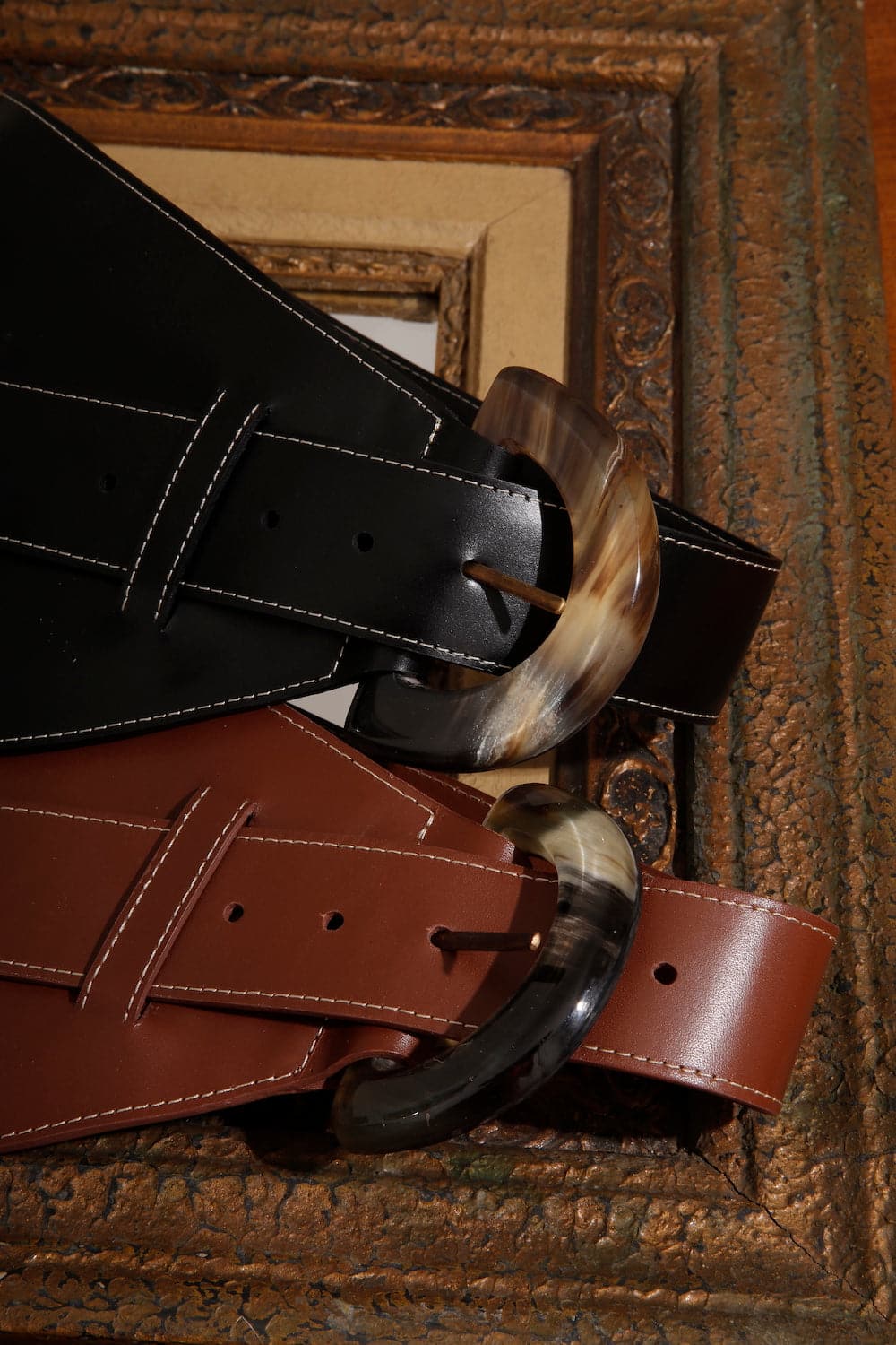 Black leather belt from Adriana Castro's La Jefa collection, featuring a sleek design and high-quality craftsmanship.