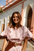 Brown leather belt by Adriana Castro with a sleek, minimalist design and a subtle buckle detail.